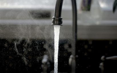 a faucet running water from a kitchen sink